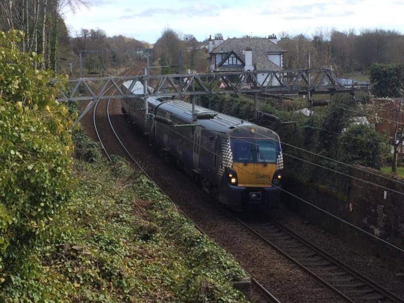 334031 at Bowling: 334031 speeds through Bowling on Saturday 11th April 2020 while working the 2V37 13:24 Springburn to Dumbarton Central. Photo of 334031 at Bowling