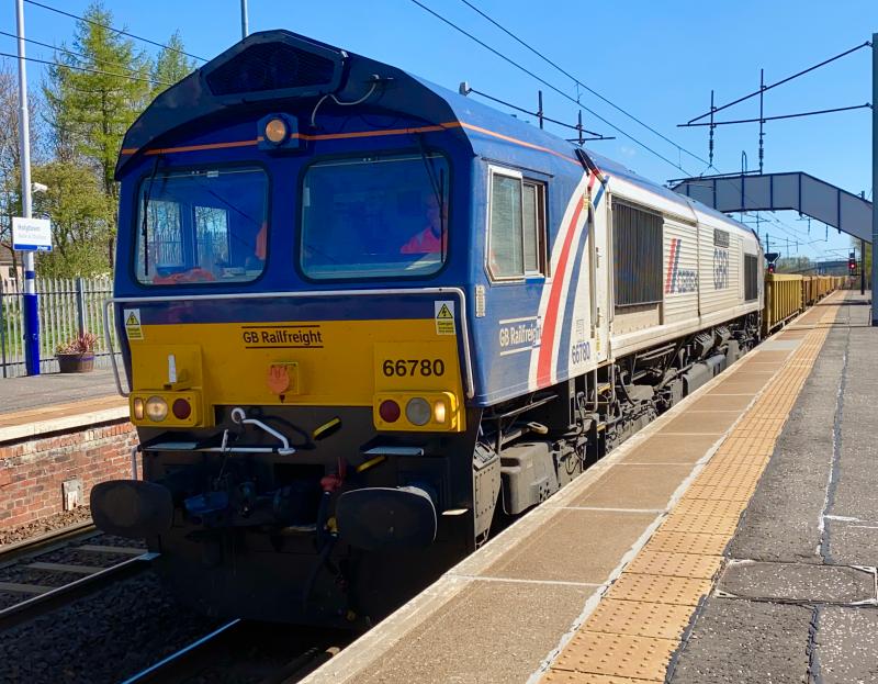 The Cemex Express: Cemex liveried GBRf Class 66 no. 66780 passes through a sunny Holytown with the early running 6K03 Law Jn. - Millerhill engineers service. Photo of The Cemex Express