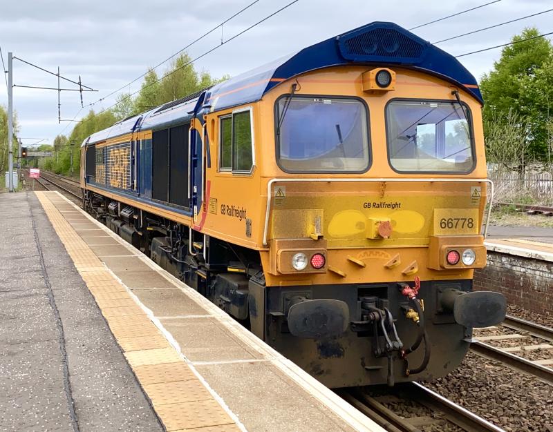 Angry Shed?: GB Railfreight Class 66 no. 66778 working 0G67 from Tyne Dock to Mossend, slowly crawls through Holytown. Amidst the mucky rear end of the loco, a face appears to have been drawn on. Photo of Angry Shed?