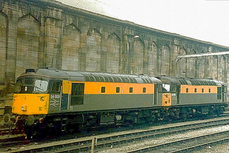 26003 at Carlisle: Waiting to take over a Charter train from Carlisle to York, via Newcastle and the coast to Northallerton 26003 and classmate 26005 in Engineers livery are pictured on 13th March 1993. Photo of 26003 at Carlisle
