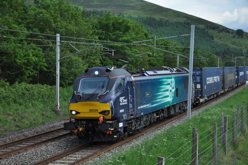 WCML Intermodal: 88009 heads a northbound intermodal at speed as it approaches the site of Lamington station on the evening of 17th June 2020. Photo of WCML Intermodal