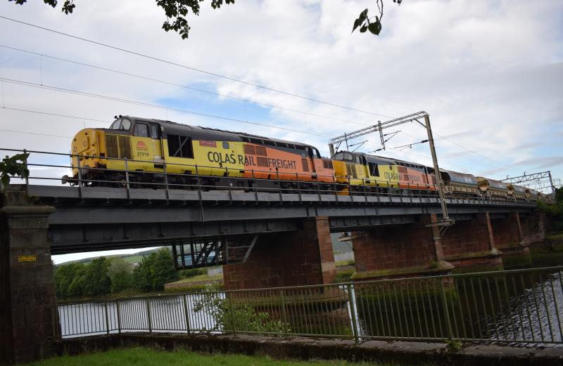 WHL ballast train 20.6.20: Colas 37219 leads 37421 with a consist of HQAs west over the River Leven approaching Dalreoch station running some 24 mins late. Photo of WHL ballast train 20.6.20