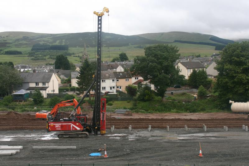 Highland Spring Yard, Blackford 29/06/20: Pile driver with driven piles to its right in the new Highland Spring yard at Blackford. Photo of Highland Spring Yard, Blackford 29/06/20