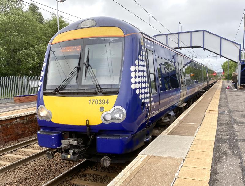 Shotts Turbo: Due to a problem with one of the 385s working the via Shotts, this allowed a rare opportunity for a class 170 to work down the Shotts line. 170394 is seen here working the late running 2Y49 from Waverley. Photo of Shotts Turbo