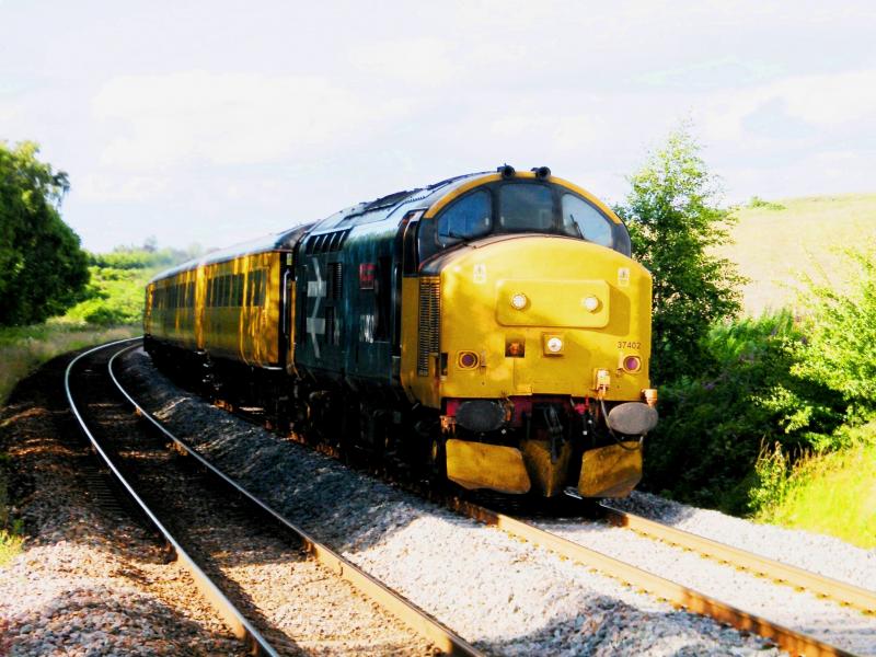 37402 @ Gleneagles - 13 July 2020: Leading 1Q79 through deep shadows, cast by line-side trees Photo of 37402 @ Gleneagles - 13 July 2020