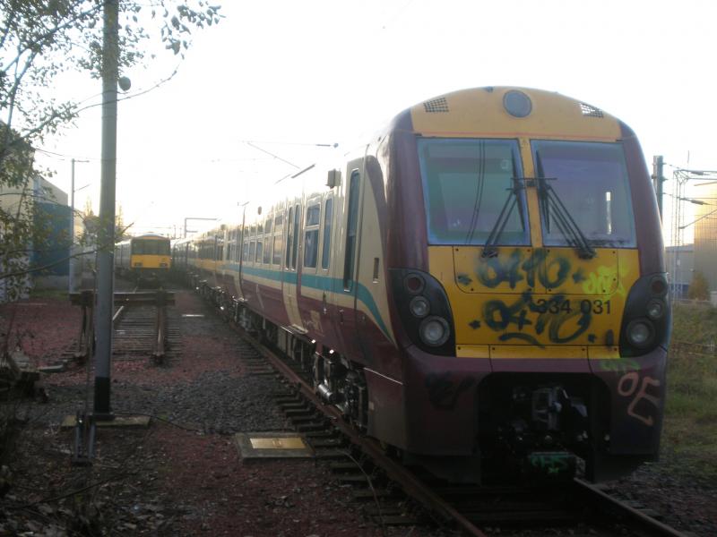 334031 at Shields: Today Juniper 334031 was tagged by vandals at Shields Depot, just after completing a C4 overhaul (having been signed out on the 31st). The unit was still waiting to enter traffic. Photo of 334031 at Shields