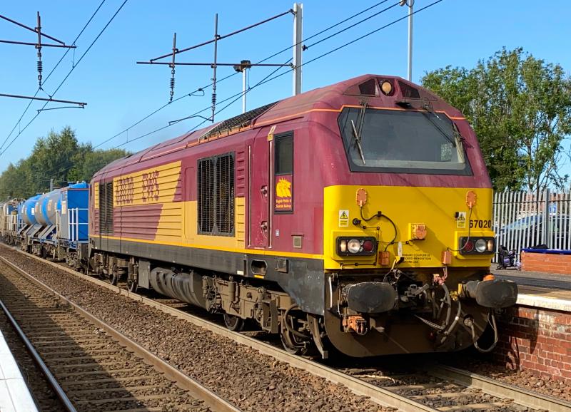 Last for the Week: Doing their last journey of this week, EWS livery DB Cargo Class 67, 67020 leads through a bright and sunny Holytown. Silver 67012 was trailing at the rear, looking a little filthy, naturally for a RHTT working. Photo of Last for the Week