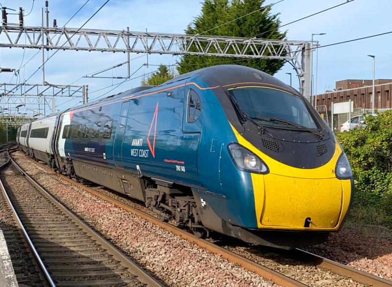 New Brand on the West Coast: Wearing partial Avanti West Coast branding (only the two driving cars were painted), 390148 is seen on approach to Motherwell in late afternoon sunlight. Photo of New Brand on the West Coast