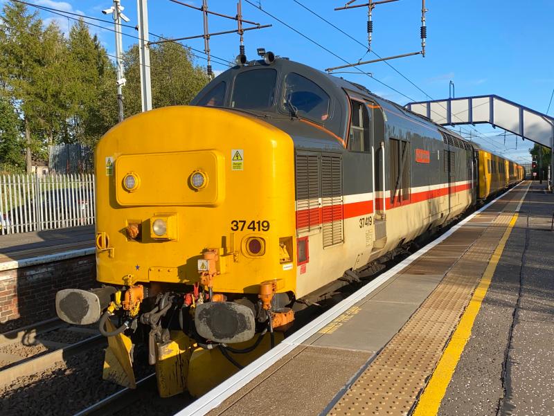 Sunny Intercity: By some stroke of a miracle the sun actually decided to stay out. Intercity Mainline liveried 37419 heads the monthly PLPR through Holytown, assisted by BR Blue 37407 which was at the rear of the set. Photo of Sunny Intercity