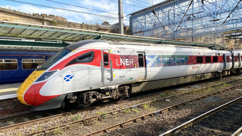Tartazuma: Branded with Scottish Tartan vinyls, LNER Azuma Class 800 no. 800104 is seen sitting at Carlisle with a diverted Edinburgh to Kings X service. Photo of Tartazuma