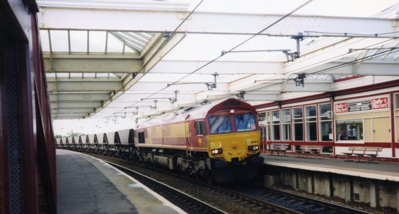 Early days: A very fresh looking 66004 comes through Troon in May 1999 with a train of empty hoppers from Falkland Jn to Hunterston in the early days of Class 66 operation in Ayrshire. Photo of Early days