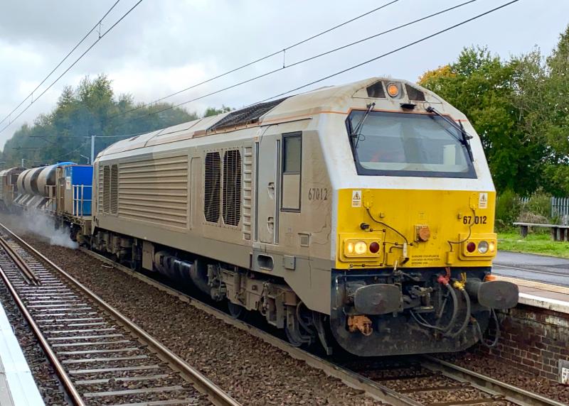 Grey Loco, Greyer Skies: Yet another failed attempt at photting 67012 in the sunlight, now looking even dirtier than before, as it passes through Holytown just before an isolated shower started. Photo of Grey Loco, Greyer Skies