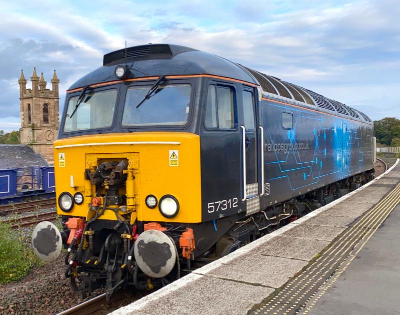 Roger En Route: Rail Ops. Group Class 57, no. 57312 slowly pulls into Kilmarnock station platform 3. The loco was momentarily held at a red before getting the go ahead towards Bonnyton Depot. Photo of Roger En Route