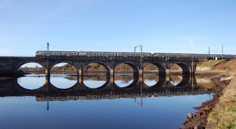 River Irvine reflection: Sunday Nov 2nd and the first Glasgow-Ayr train of the day crosses Campbells bridge at Irvine Photo of River Irvine reflection