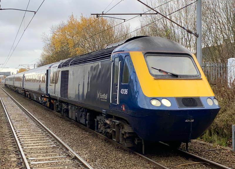 Holytown HST: A rare sight for Holytown, as a ScotRail HST set headed by 43136 approaches the station working 5S01 Slateford to Inverness ECS move, leading rake HA14 and powercar 43176 behind it. Photo of Holytown HST