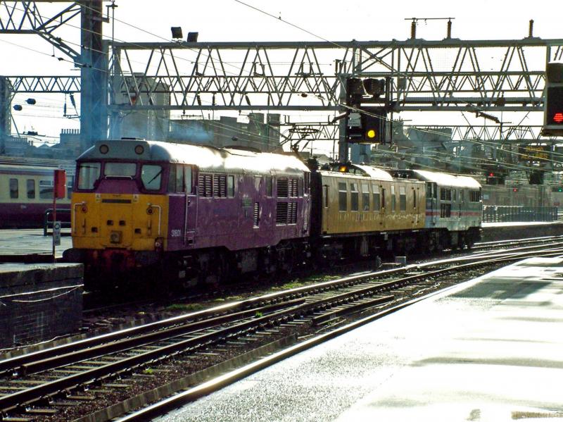 31601 at Glasgow Central: Wearing its unique purple livery 31601 waits at Glasgow Central with the Mentor OHL Inspection Train on 24th January 2008. Classmate 31454 wearing Inter City livery is on the rear. Photo of 31601 at Glasgow Central