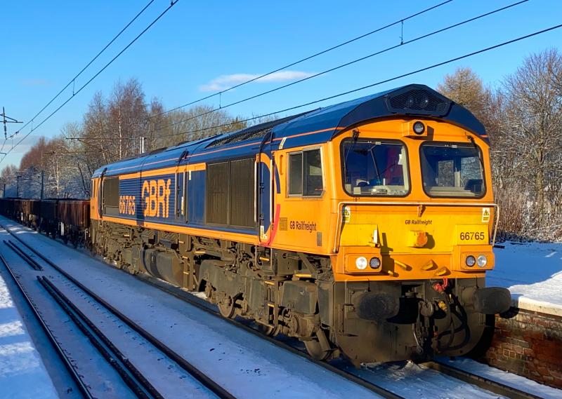 Shed in the Snow: GB Railfreight Class 66 no 66765 heads the 6K34 Cowlairs to Carlisle engineers through Holytown on the snow covered day of 29/12/2020 Photo of Shed in the Snow