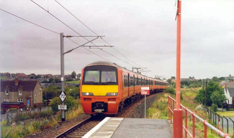 Orange days: September 1993 and Strathclyde red liveried 320322 Festive Glasgow Orchid and 320316 arrive at Drumgelloch with a train from Balloch. Photo of Orange days