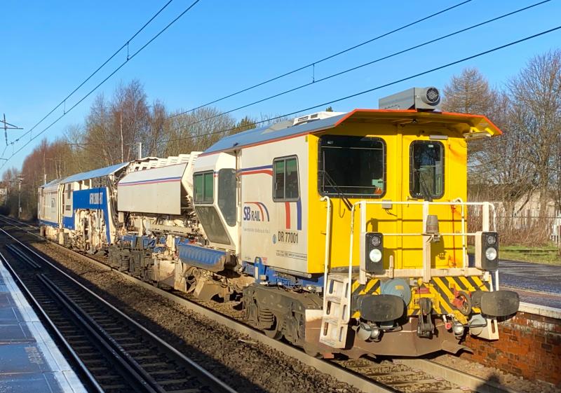 Regulator Running South: On the sunny Friday morning of 22/01/2021, SB Rail Ballast Regulator/Automatic Finishing Machine DR77001 heads southwards through Holytown shortly after switching ends at Motherwell TMD. Photo of Regulator Running South
