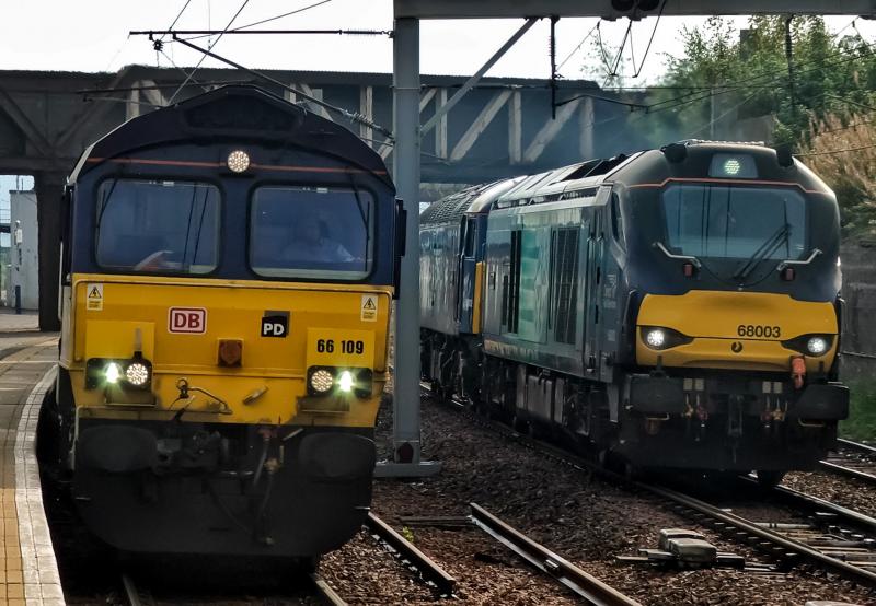 66109: 66109 waits at Carstairs while 0S69 passes heading for Motherwell as 68003&57002 Photo of 66109