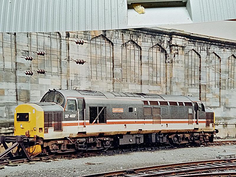 37407 at Carlisle: Wearing Inter City livery, 37407 waits at Carlisle for its next turn of duty on 18th May 1997. Photo of 37407 at Carlisle