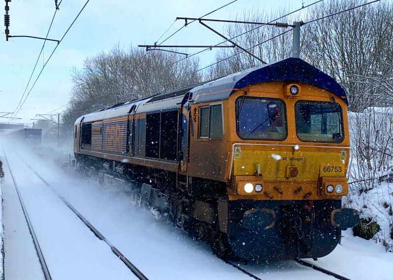 Wintermodal: Pushing through the snow in a light sleet shower, GB Railfreight 66753 runs through Holytown working 4S69 Doncaster - Elderslie intermodal on 09/02/2021 Photo of Wintermodal