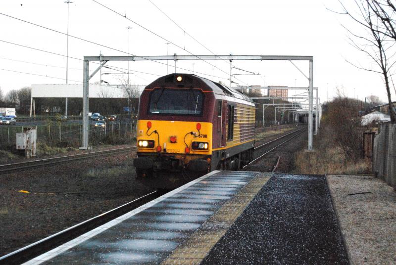 67011 Deanside Bound: 67011 Slowly Passing through Cardonald Station on its way into Deanside Transit.
314215 on the following service to Gourock was halted in the Station as the points could not be reset. Photo of 67011 Deanside Bound