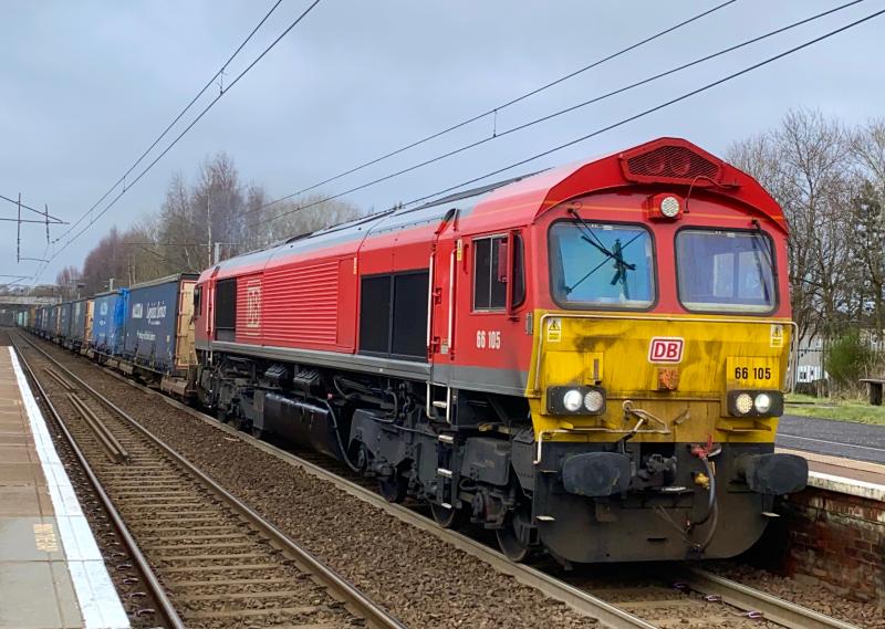 Dirty Bahn: With a pretty weathered looking front, DB class 66, no. 66105 heads through Holytown working the Grangemouth - Daventry intermodal. (06/02/2021) Photo of Dirty Bahn