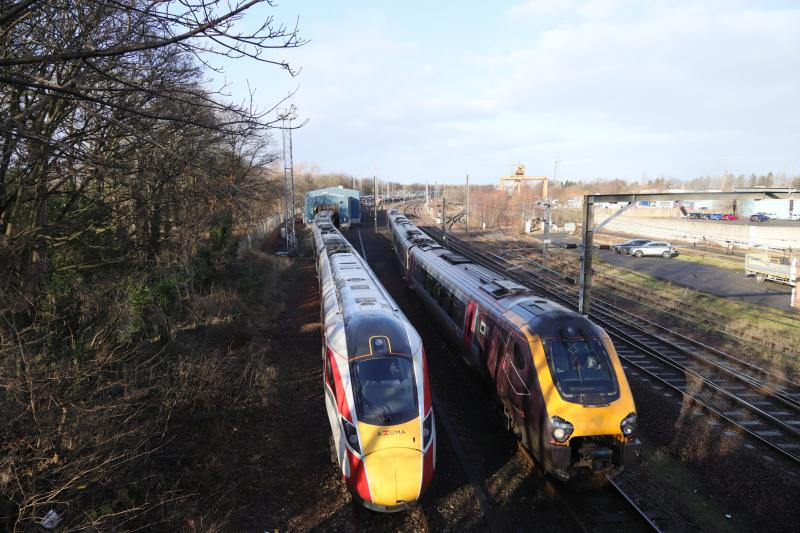 5A06: 220018 leaving Craigentinny on 5A06 10.39 to dundee via Morningside passing 801218 in the Wheel Lathe being shunted by a class 08 on 16/02/2021 Photo of 5A06