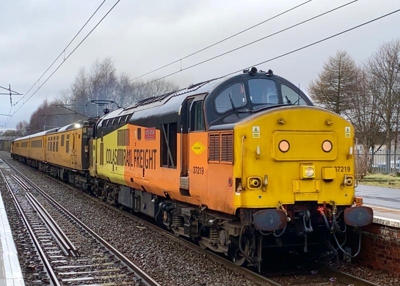 Tractor in Torrential Downpour: At the head of 1Q18 Mossend - Mossend, Colas 37219 opens up through Holytown station in typical Scottish weather on 18/02/2021 Photo of Tractor in Torrential Downpour