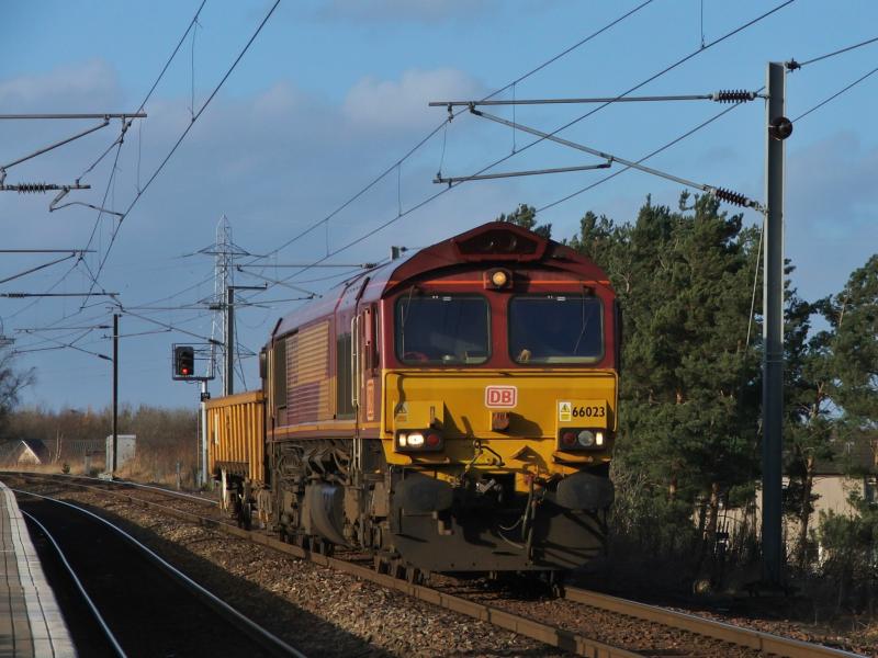 66023: 66023 with a very lightly loaded 6S50 Carlisle-Millerhill consisting of 1 Jna wagon Photo of 66023