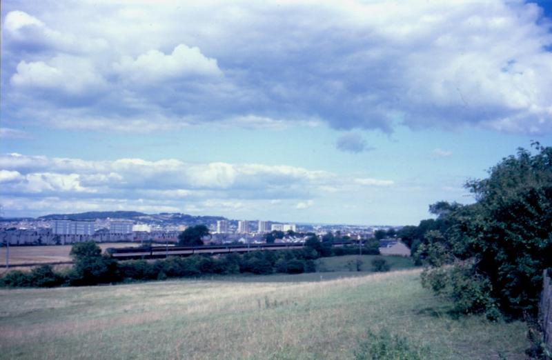 Electric drag 1: Passing Baberton, on the outskirts of Wester Hailes, on 21/8/94, is 86 223, dead in tow at the rear of the 11.34 Manchester Piccadilly - Edinburgh. 47 848 was at the front of the train. Photo of Electric drag 1