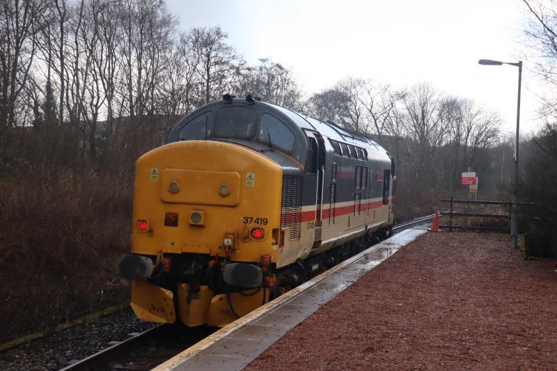 37419 @ Connel Ferry: As part of a 2 day WHL route learning trip it ran today from Crianlarich to Motherwell via Oban. Picture taken this afternoon as it ran non-stop through Connel Station on its way to Oban. Photo of 37419 @ Connel Ferry