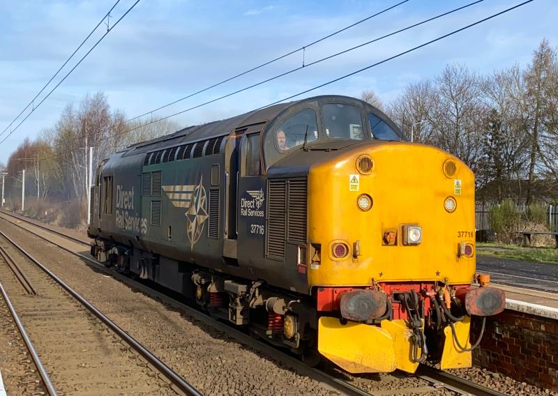 Light Loco in Sunlight: The only picture I managed in full sun on the morning of 10/03/2021. 37716 works the 0C51 Motherwell TMD to Carlisle Kingmoor LE move opening up through Holytown. Photo of Light Loco in Sunlight