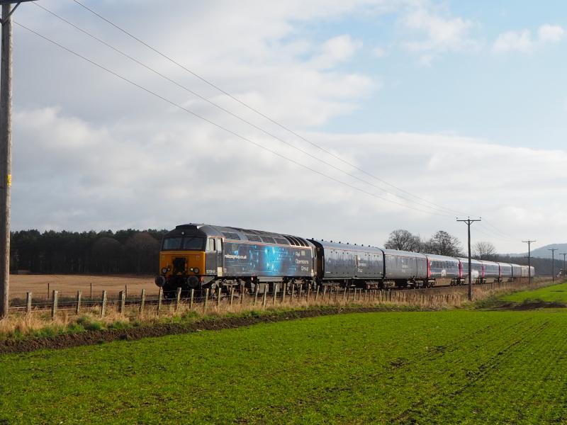 57312 24 March 2021: 57312 leads 5E25 Dundee to Rotherham past Bow of Fife LC on 24 March 2021. Consist was 4 redundant Mk3 coaches plus barriers. Photo of 57312 24 March 2021