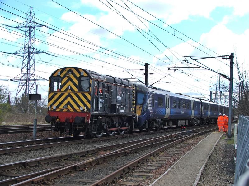 08596: 08596 hauling 385031 under some awful sky Photo of 08596