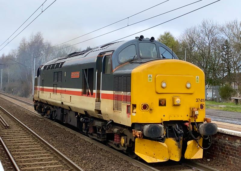 Return to Home Base: Intercity Mainline livery DRS Class 37 no. 37419 working the early running 0M69 Motherwell TMD - Carlisle Kingmoor LE move thrashes past Holytown in classic Scottish full dull conditions. (14/04/2021) Photo of Return to Home Base