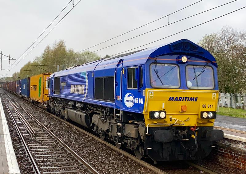 Maritime Modal: Maritime liveried DB Class 66 66047 at the head of the 4S99 Grangemouth - Tees Dock intermodal service crawls through Holytown. Typical Scottish weather back in full swing! (26/04/2021) Photo of Maritime Modal