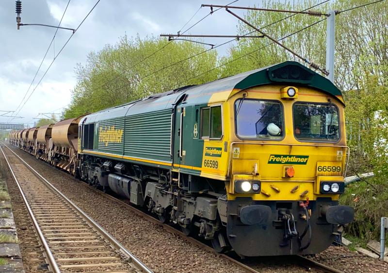 Engieliner: Freightliner Class 66, 66599 slowly approaches Holytown working the 6K16 Millerhill - Shieldmuir engineers with a rake of autoballasters, routed via Mossend East Jn.(09/05/2021) Photo of Engieliner