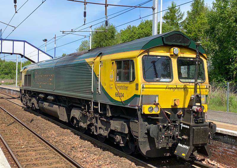 Laser Fred: Equipped with the RILA laser scanner, Freightliner Powerhaul liveried 66504 stands at Holytown platform 2 on a red signal working 0K70 Millerhill - Millerhill via Carstairs, Wishaw and Mossend North Jn. (02/06/2021) Photo of Laser Fred