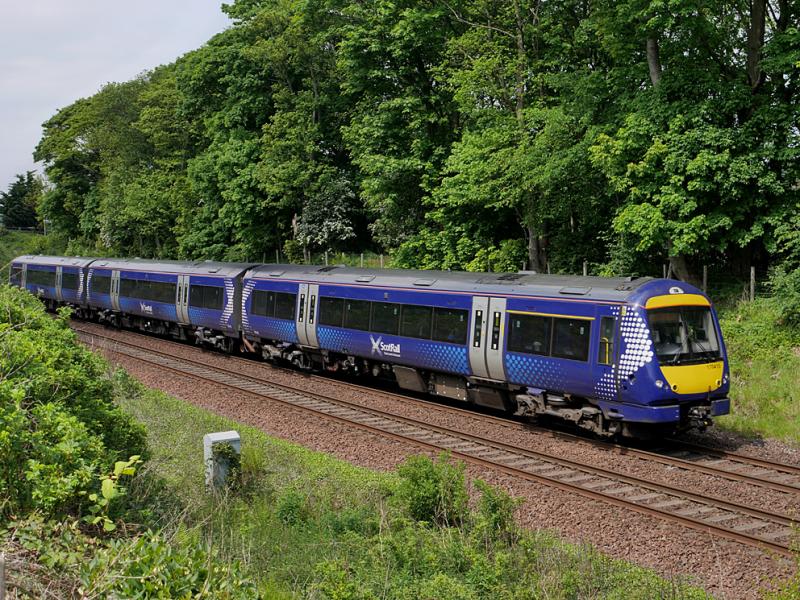 Dalgety 170: 170410 nears Dalgety Bay with an Edinburgh - Glenrothes with Thornton service on 3 June 2021. The trees in the background are to be cut down/pruned for safety purposes. Photo of Dalgety 170