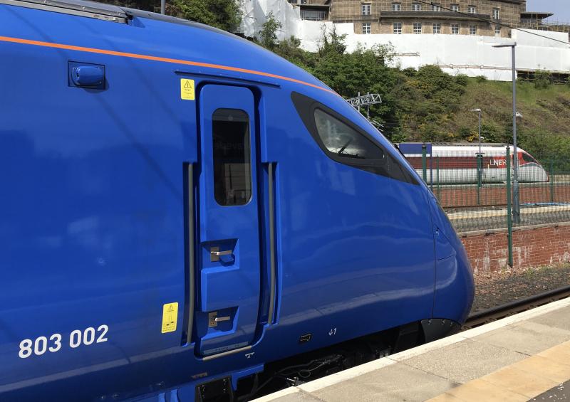 Preparing to compete: East Coast Trains Ltd 803 002 watches, while across the way LNER 801 219 prepares to depart with 1E21 16.00 to King's Cross. Setting the pace, it arrived in London 8E. Waverley 07.06.2021. Photo of Preparing to compete