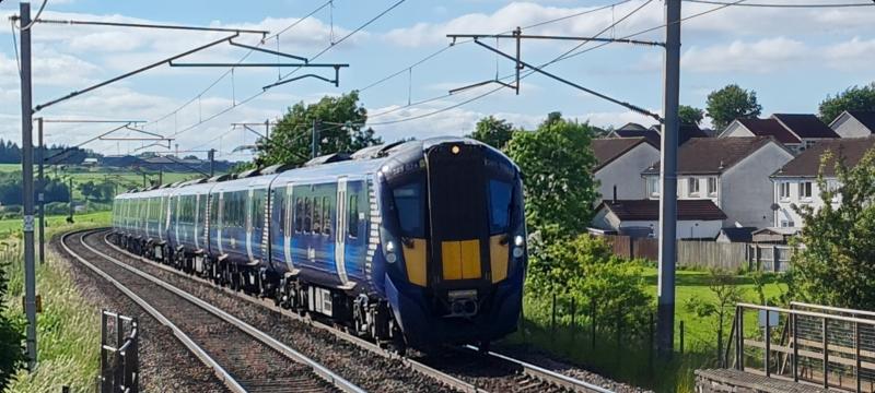 Sunny Carluke: 385 026 leads classmate 385 043 into Carluke whilst working 2B72 , 17:21 Glasgow Central - Lanark , Saturday , 12th June , 2021 . Photo of Sunny Carluke