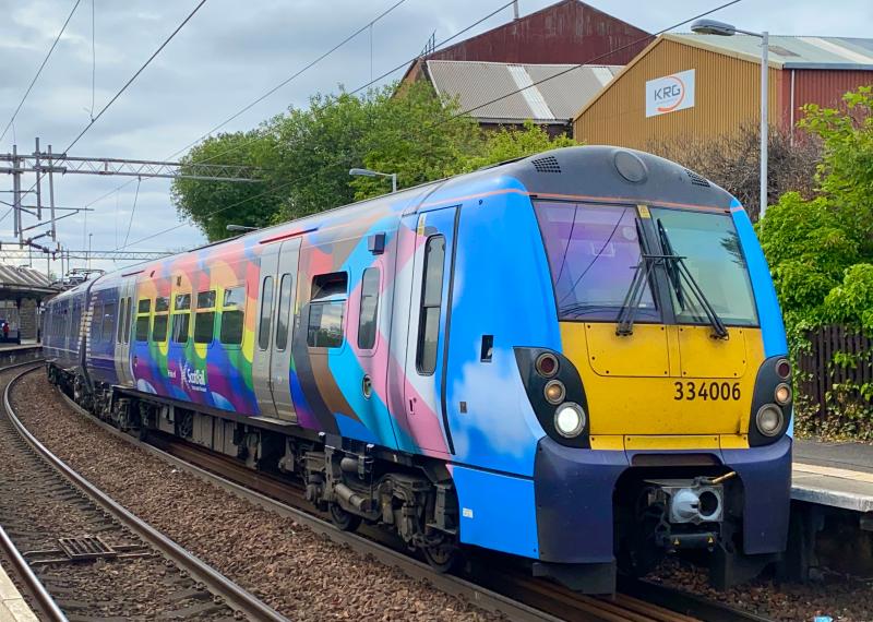Juniper Pride: With its front carriage decorated in Pride vinyls, ScotRail 334006 departs from Coatbridge Sunnyside working 2H18 Helensburgh Central - Edinburgh Waverley, classmate 334038 on the rear. (26/06/2021) Photo of Juniper Pride