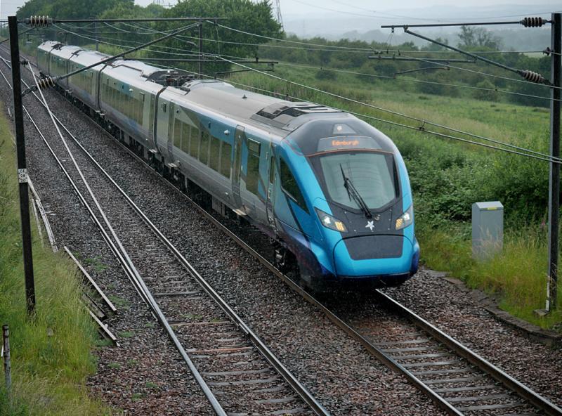 Camps TPE: 397003 passes the site of Camps Junction with the 12.10 from Manchester Airport to Edinburgh on 10 July 2021. Photo of Camps TPE
