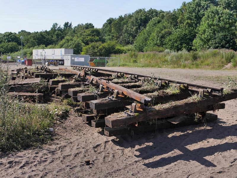 Levenmouth track lifting: Lifted track panels at Kirkland Yard, adjacent to the Fife Heritage Railway's depot. The contractor's compound is in the background. 24 July 2021. Photo of Levenmouth track lifting