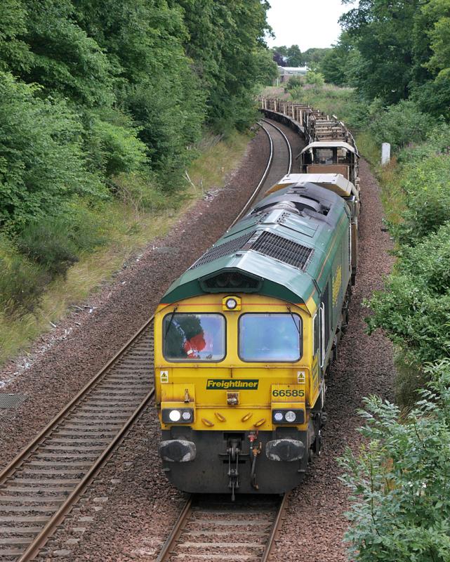 Dalgety 66: 66585 nears Dalgety Bay with an empty raildrop train from Insch to Millerhill. 66529 is out of sight on the rear. 1 August 2021. Photo of Dalgety 66