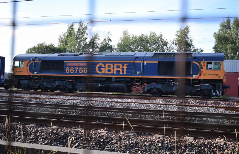 66756 at Elderslie: 66756 The Royal Corps of Signals waits in Malcolms yard at Elderslie as the reach stacker loads containers for the service to depart for Tees Dock as 4E69 on 3.8.21 Photo of 66756 at Elderslie