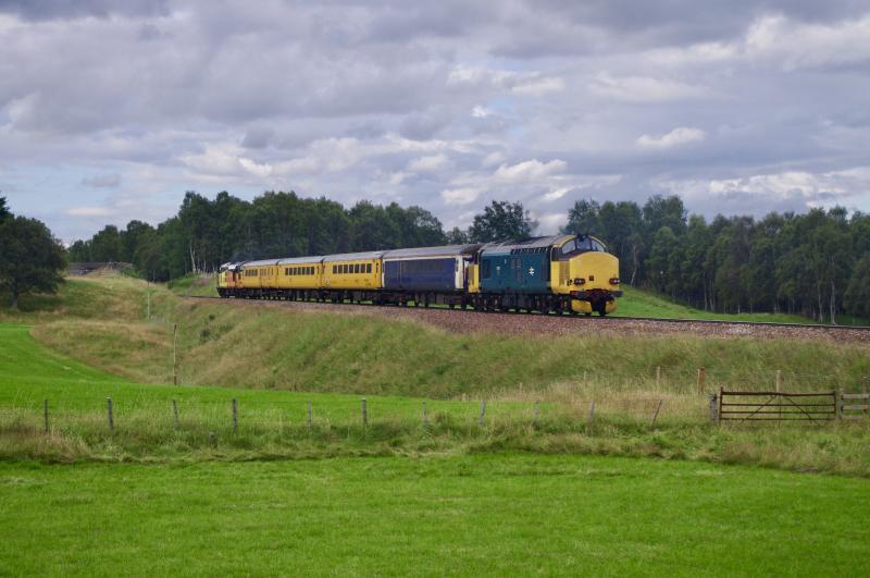 37610: 1Q77 Mossend Inverness, 37116 & 37610 northbound through Aviemore. 7Aug21. Photo of 37610