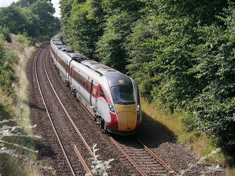 Dalgety Azuma: LNER Azuma 800107 climbs away from Dalgety Bay with the 10.00 from Kings Cross to Aberdeen. The surrounding trees are to be cut back or felled by Network Rail contractors before the end of the year. 24 August 2021. Photo of Dalgety Azuma